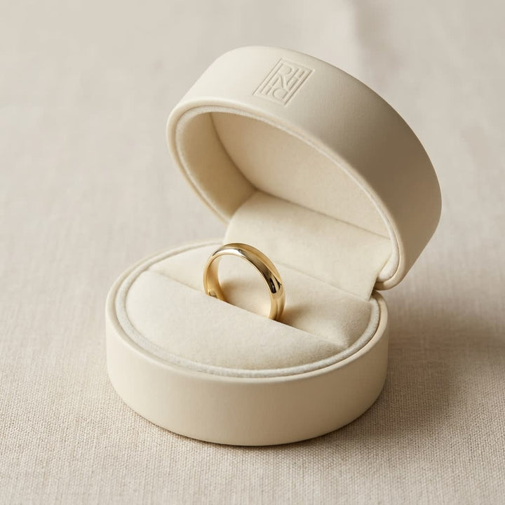 4mm High Dome Comfort-Fit Wedding Band in 14K Yellow Gold, in navy velvet jewelry box