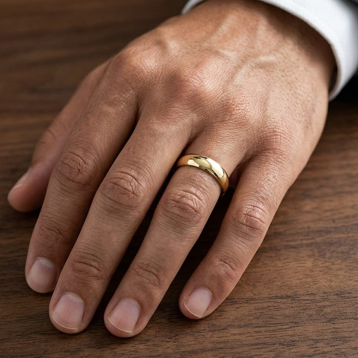 5mm High Dome Comfort-Fit Wedding Band in 14K Yellow Gold, worn on hand, masculine close-up