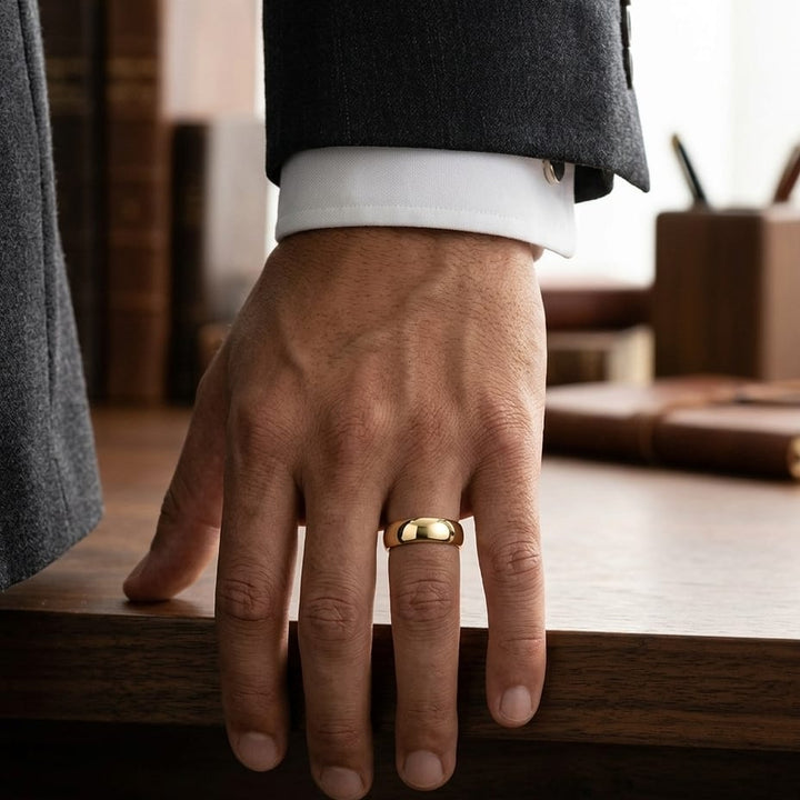 7mm High Dome Comfort-Fit Wedding Band in 14K Yellow Gold, worn on hand, masculine full view