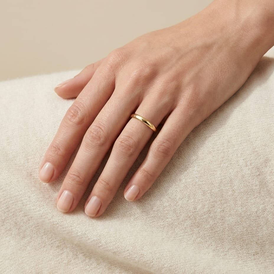 2mm Slightly Domed Comfort-Fit Wedding Band in 14K Yellow Gold, worn on hand, full view