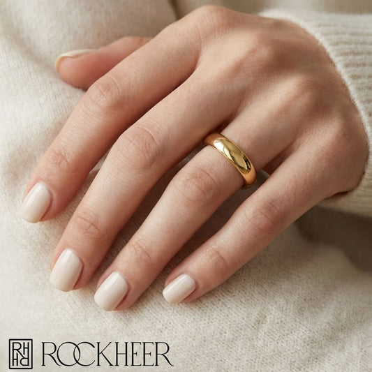 3mm Slightly Domed Comfort-Fit Wedding Band in 14K Yellow Gold, worn on hand, close-up
