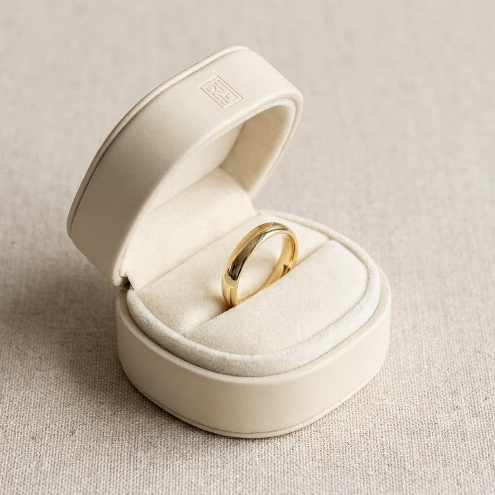 4mm Slightly Domed Comfort-Fit Wedding Band in 14K Yellow Gold, in navy velvet jewelry box