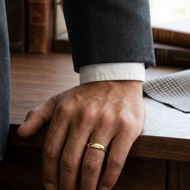 5mm Slightly Domed Comfort-Fit Wedding Band in 14K Yellow Gold, worn on hand, masculine full view
