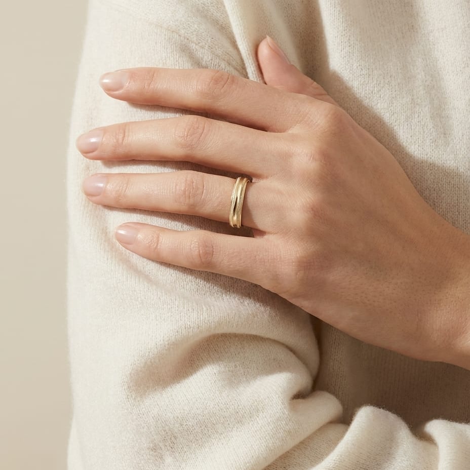 4mm Slightly Domed Double Milgrain Comfort-Fit Wedding Band in 14K Yellow Gold, worn on hand, full view