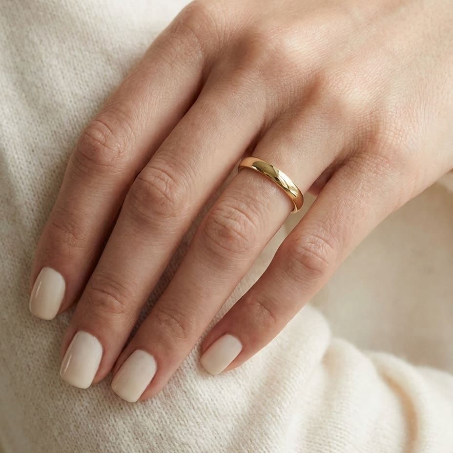 3mm Slightly Domed Super Light Comfort-Fit Wedding Band in 14K Yellow Gold, worn on hand, close-up