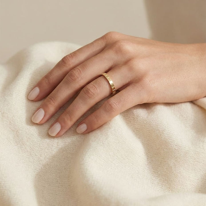 2mm High Polish Carved Wedding Band in 14K Yellow Gold, worn on hand, full view