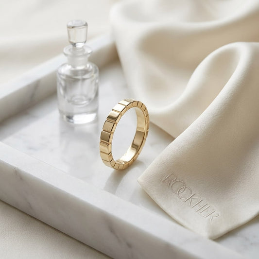 2mm High Polish Carved Wedding Band in 14K Yellow Gold, on marble vanity tray with silk