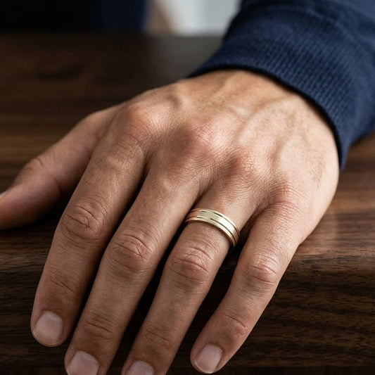 6mm Satin Finish Parallel Groove Carved Wedding Band in 14K Yellow Gold, worn on hand, masculine close-up