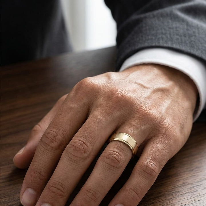 8mm Satin Finish High Polished Round Edge Carved Wedding Band in 14K Yellow Gold, worn on hand, masculine close-up