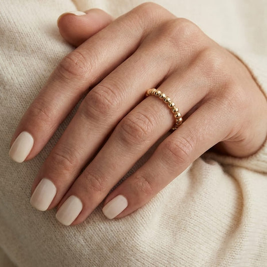 2mm Comfort-Fit Wedding Band in 14K Yellow Gold, worn on hand, close-up