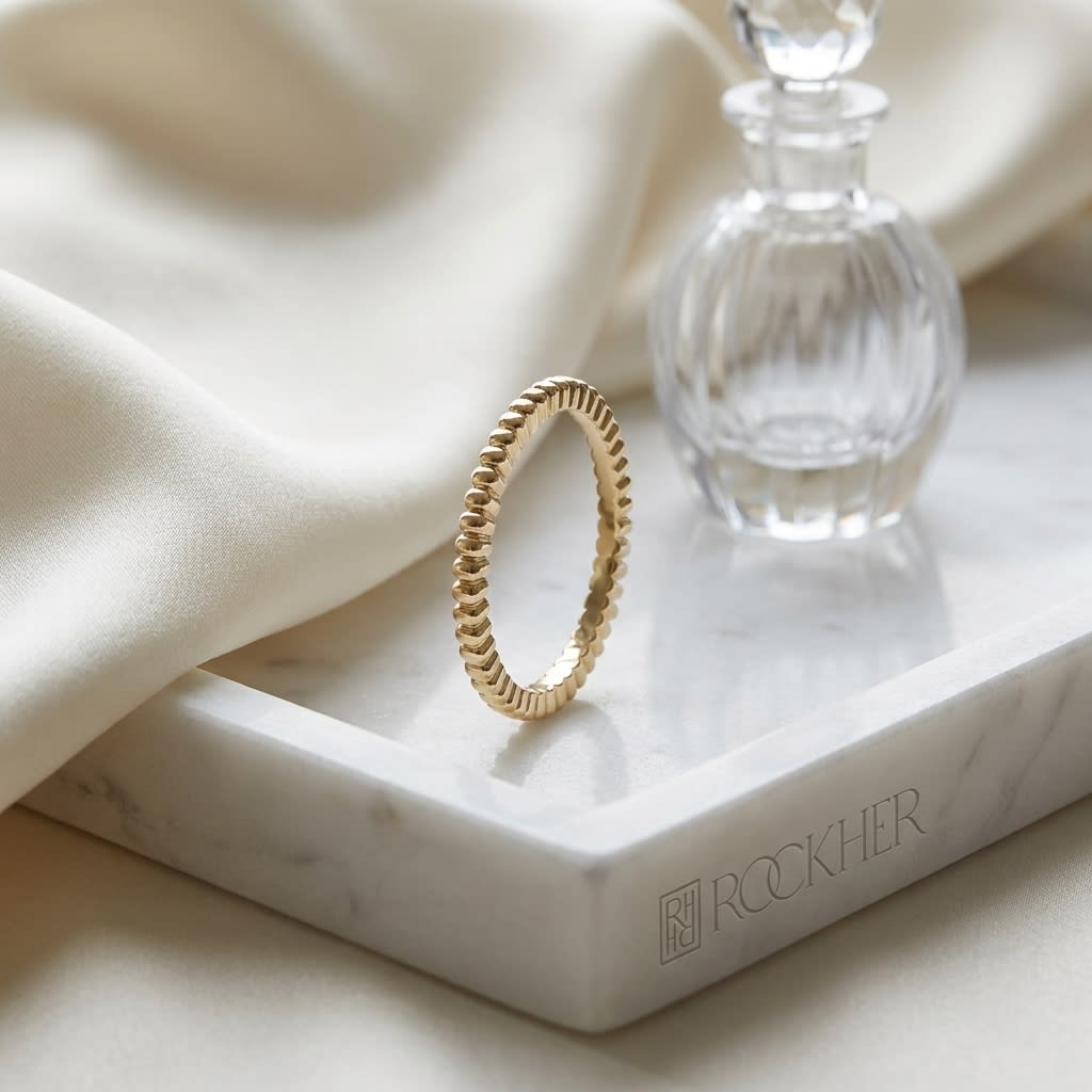 2mm Comfort-Fit Wedding Band in 14K Yellow Gold, on marble vanity tray with silk