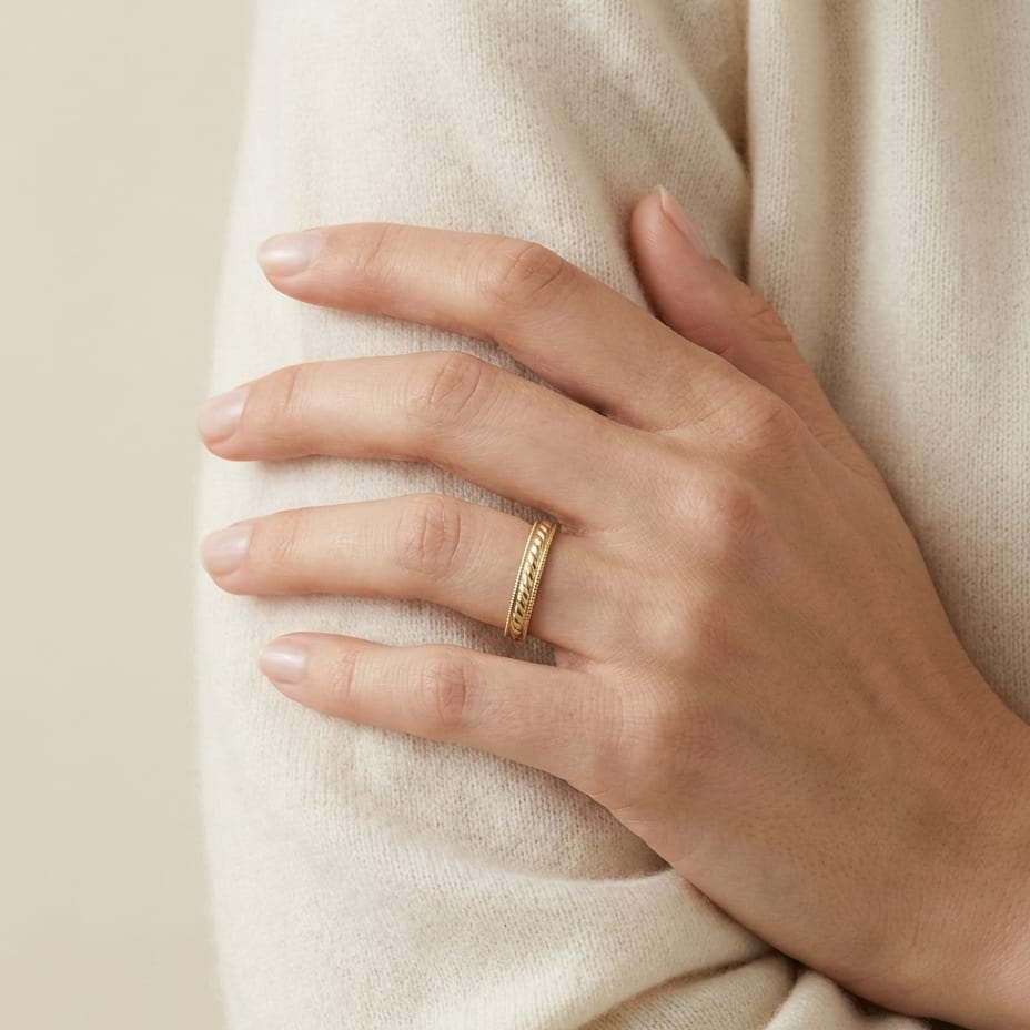 2mm High Polish Carved Wedding Band in 14K Yellow Gold, worn on hand, full view