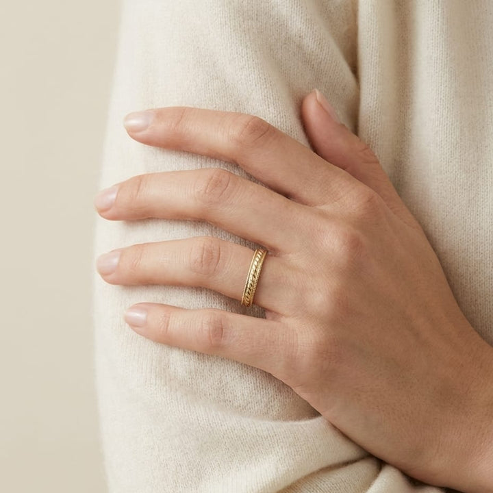 2mm High Polish Carved Wedding Band in 14K Yellow Gold, worn on hand, full view