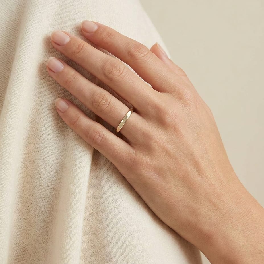 2mm High Polish Carved Wedding Band in 14K Yellow Gold, worn on hand, full view
