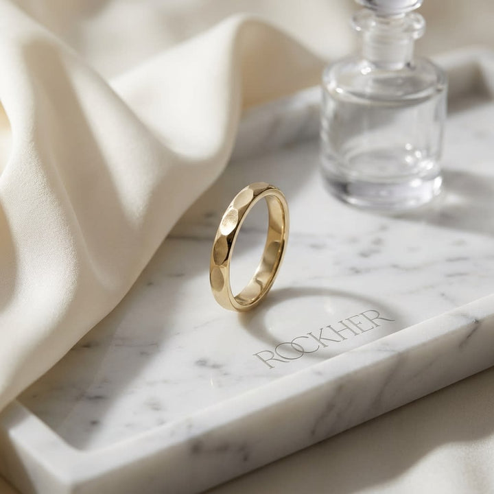 2mm High Polish Carved Wedding Band in 14K Yellow Gold, on marble vanity tray with silk
