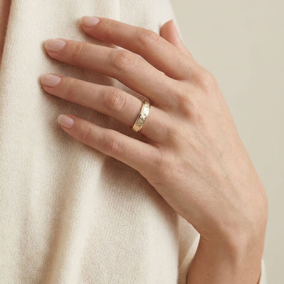 4mm Hammered Finish Carved Wedding Band in 14K Yellow Gold, worn on hand, full view
