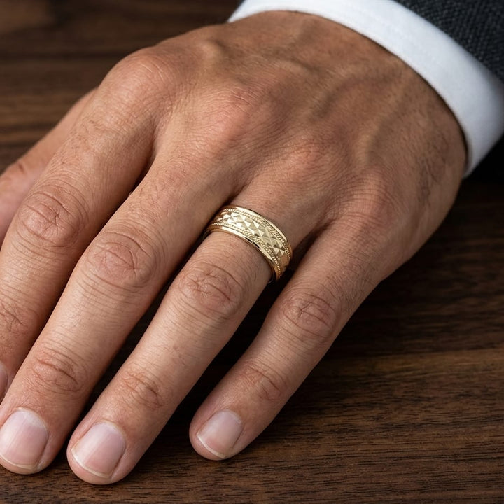 8mm High Polish Cross Hatch Center Carved Wedding Band in 14K Yellow Gold, worn on hand, masculine close-up