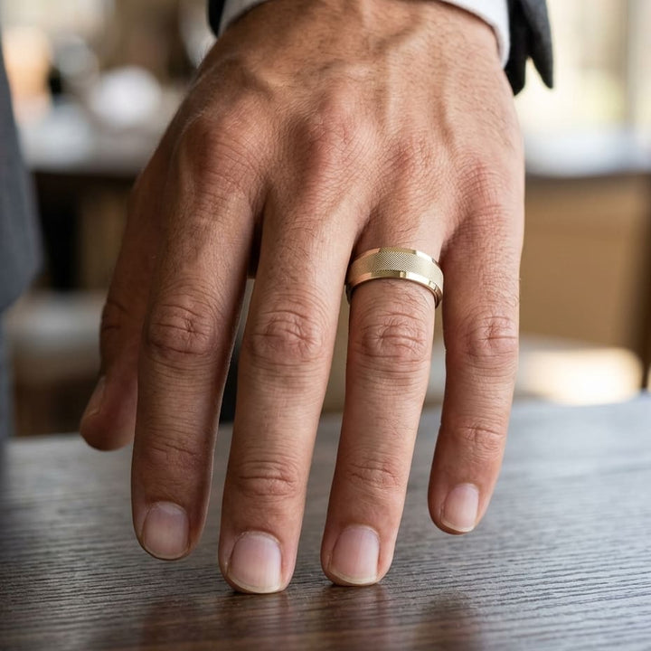 7mm High Polish Cross Hatch Center Carved Wedding Band in 14K Yellow Gold, worn on hand, masculine close-up
