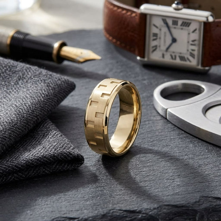 8mm Satin Finish Carved Wedding Band in 14K Yellow Gold, on walnut surface with pocket square