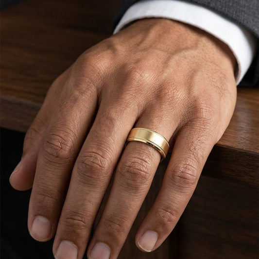 8mm Satin Finish Carved Wedding Band in 14K Yellow Gold, worn on hand, masculine close-up