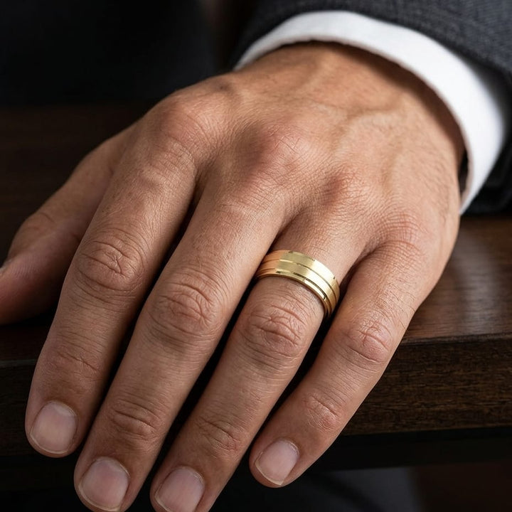 8mm Satin Finish Carved Wedding Band in 14K Yellow Gold, worn on hand, masculine close-up