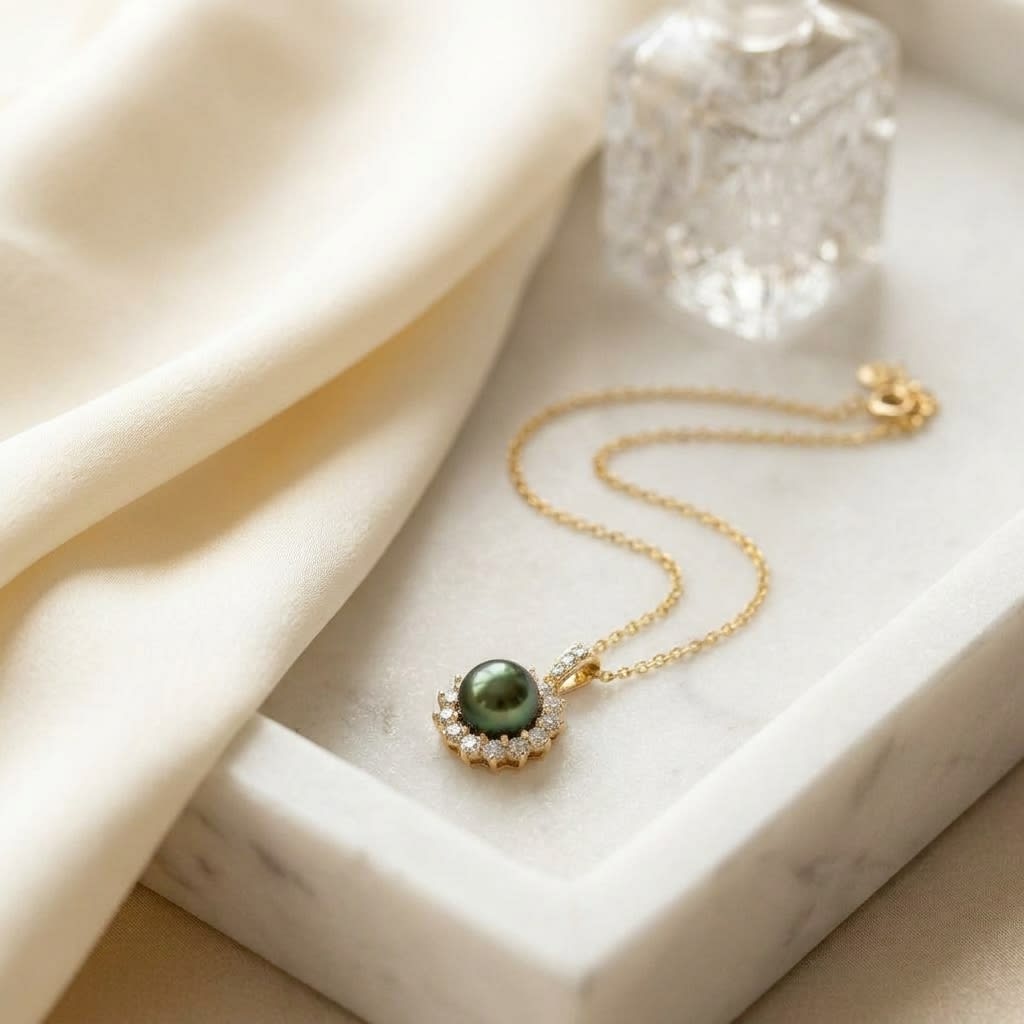 Pearl and Diamond Halo Pendant in 14K Yellow Gold, 0.76ct, on marble vanity tray with silk