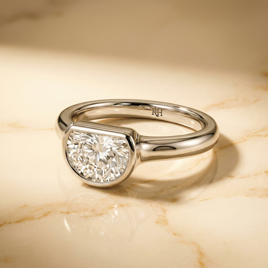 The Agnes Select bezel solitaire half cut engagement ring in 18k white gold — alt-angle hero — RockHer