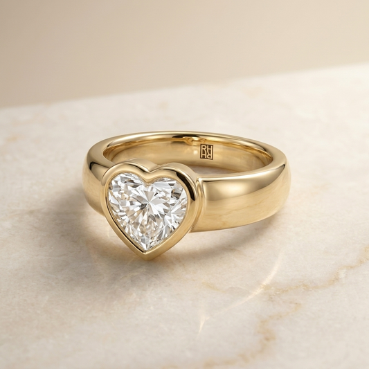 The Remi Select — Bezel-Set Cigar Band Heart in 18K Yellow Gold