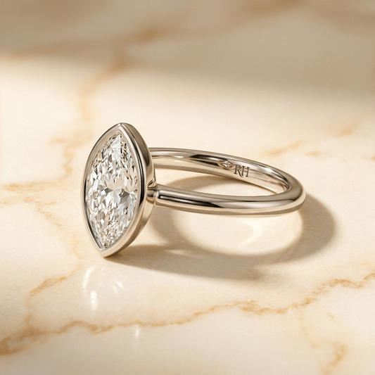 The Agnes Select bezel solitaire marquise engagement ring in 18k white gold — alt-angle hero — RockHer