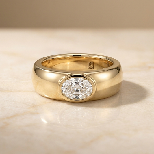 The Remi Select — Bezel-Set Cigar Band Oval in 18K Yellow Gold
