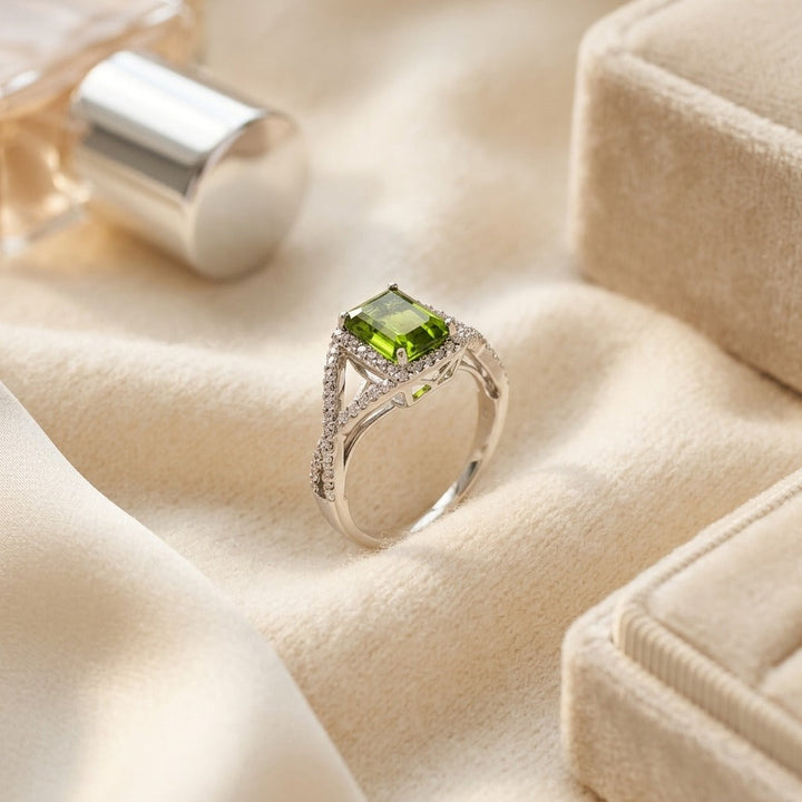 Peridot & Diamond Infinity Twist Ring in Platinum - flat lay