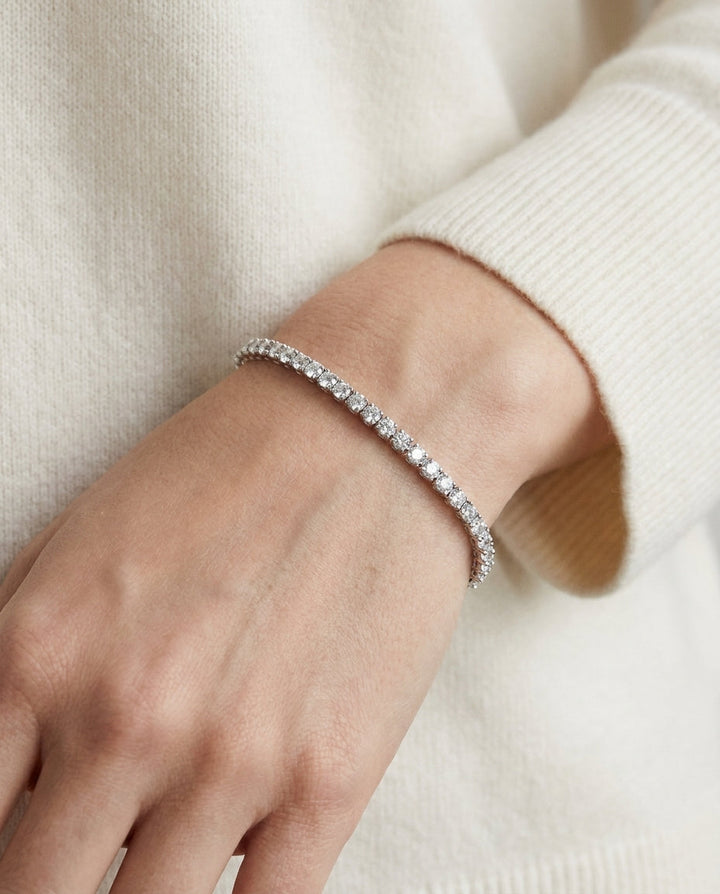 Diamond 4-prong Tennis Bracelet In Platinum (3mm), worn close-up portrait