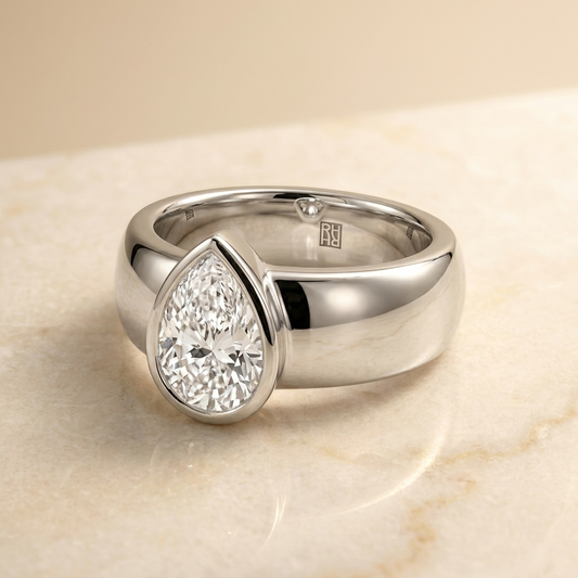 The Remi Select — Bezel-Set Cigar Band Pear in 18K White Gold