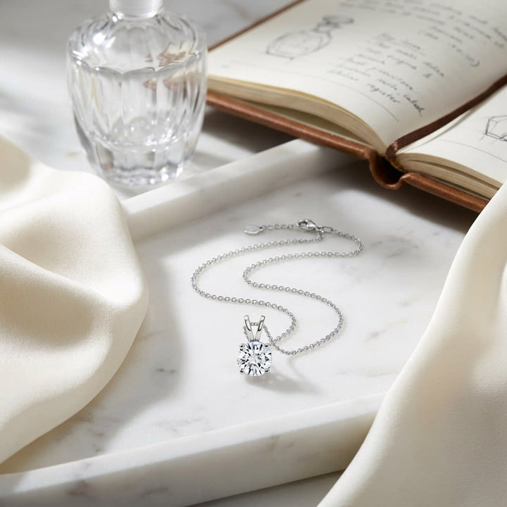 Natural Diamond Round Brilliant Solitaire Pendant in Platinum, 4 ct. t.w., on marble vanity tray with silk