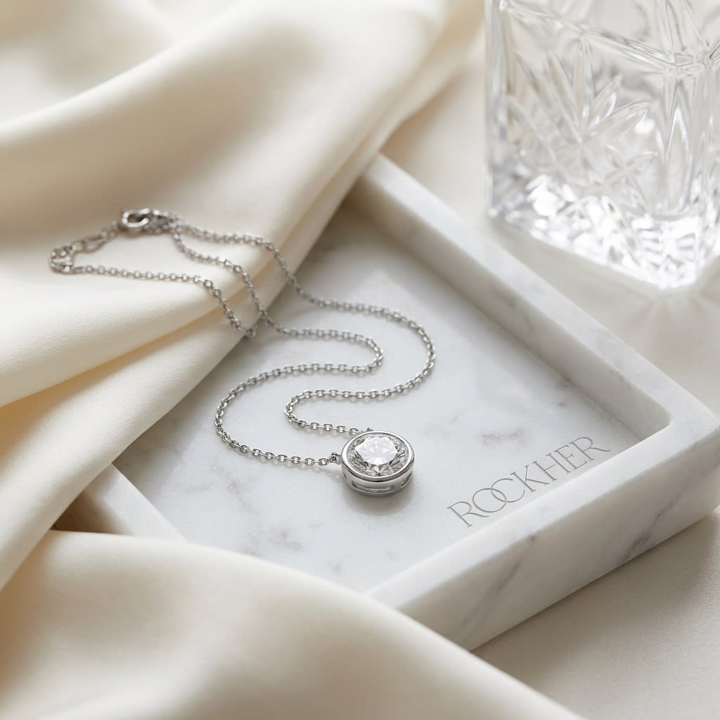 Natural Diamond Round Brilliant Solitaire Pendant in Platinum, 4 ct. t.w., on marble vanity tray with silk
