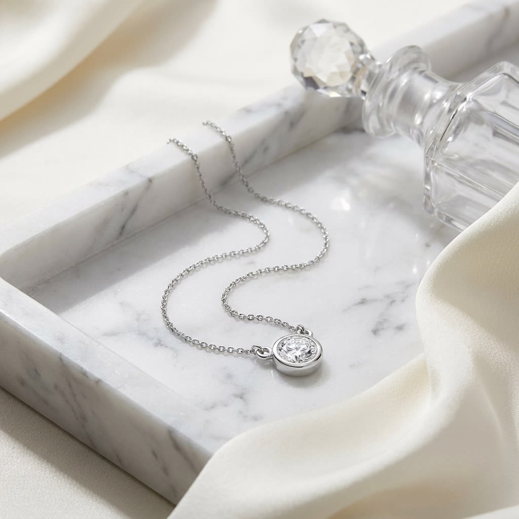 Natural Diamond Round Brilliant Solitaire Pendant in Platinum, 4 ct. t.w., on marble vanity tray with silk