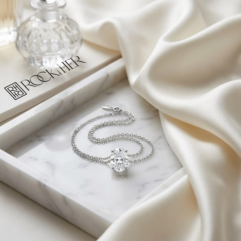 Natural Diamond Oval Solitaire Pendant in Platinum, 2 ct. t.w., on marble vanity tray with silk