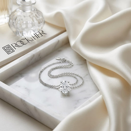 Natural Diamond Oval Solitaire Pendant in Platinum, 2 ct. t.w., on marble vanity tray with silk
