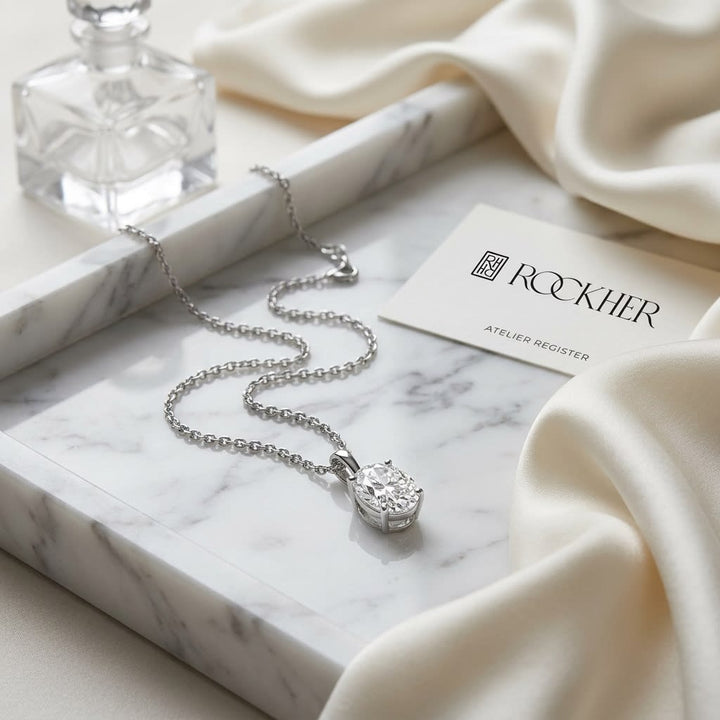 Natural Diamond Oval Solitaire Pendant in Platinum, 4 ct. t.w., on marble vanity tray with silk