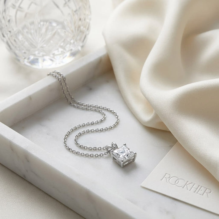 Natural Diamond Princess Cut Solitaire Pendant in Platinum, 4 ct. t.w., on marble vanity tray with silk