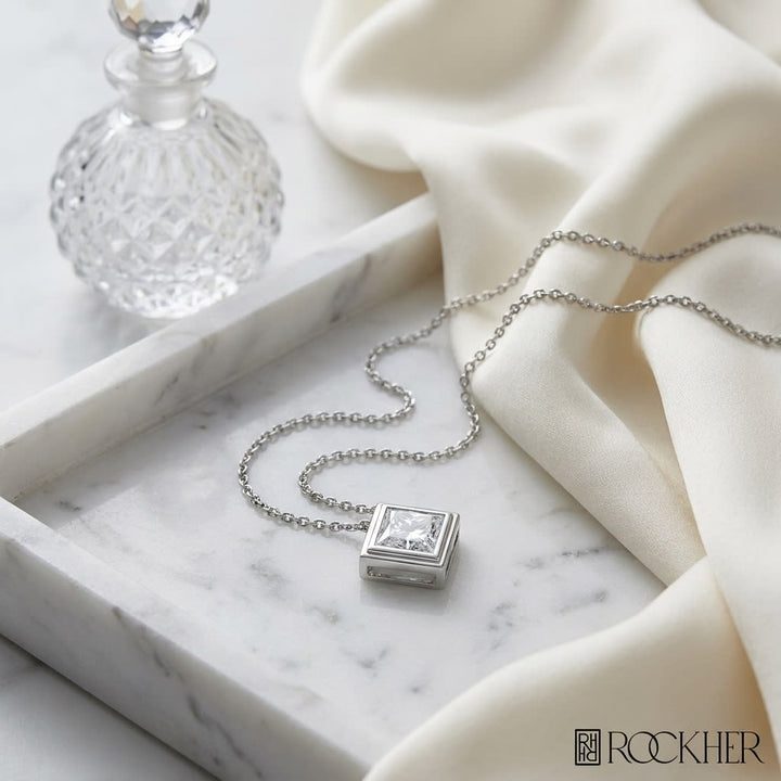 Natural Diamond Princess Cut Solitaire Pendant in Platinum, 4 ct. t.w., on marble vanity tray with silk
