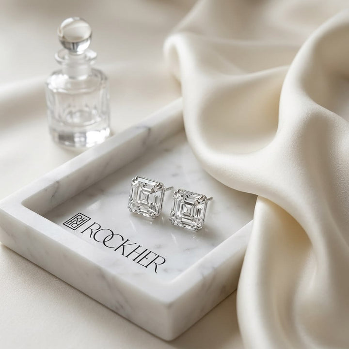 Natural Diamond Asscher Cut Stud Earrings in Platinum, 4 ct. t.w., on marble vanity tray with silk