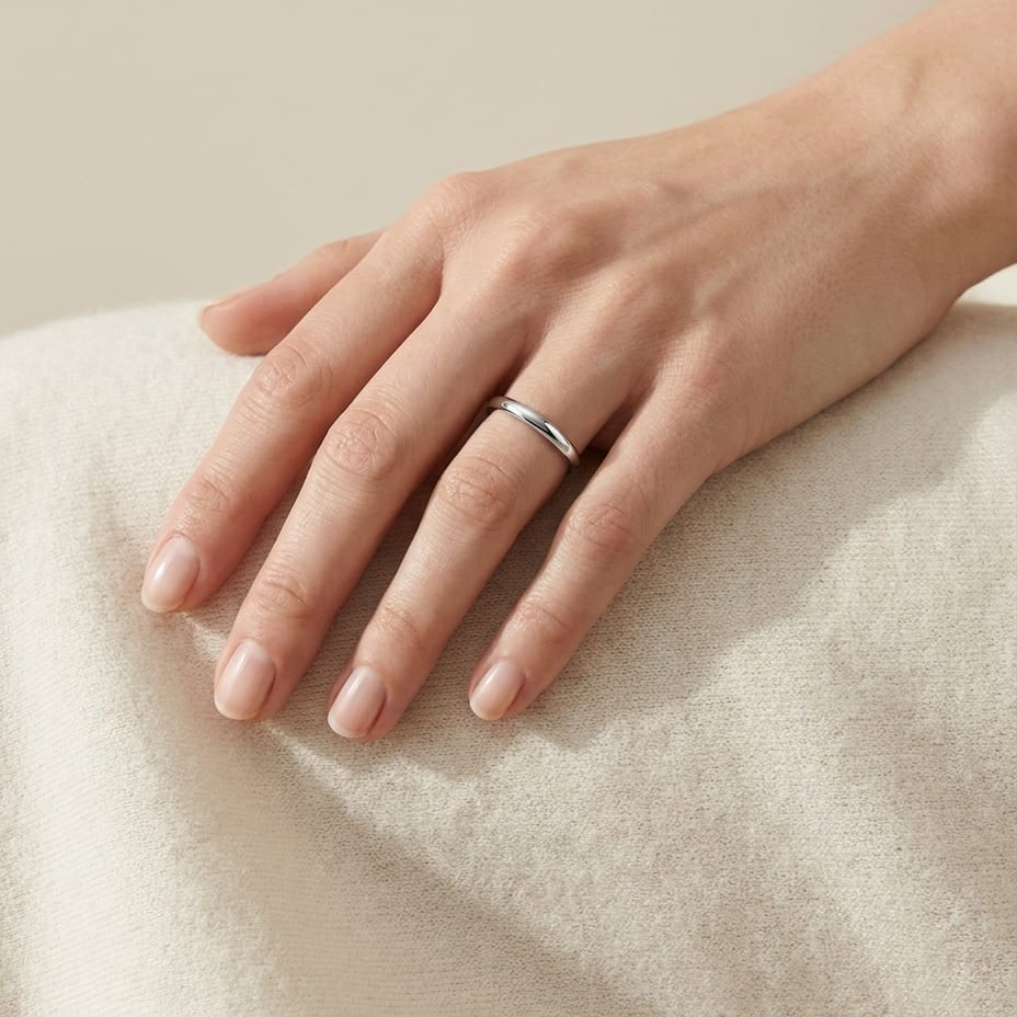 2mm Slightly Domed Traditional Oval Wedding Band in Platinum, worn on hand, full view