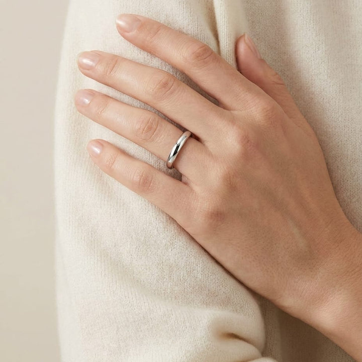 2.5mm Slightly Domed Traditional Oval Wedding Band in Platinum, worn on hand, full view