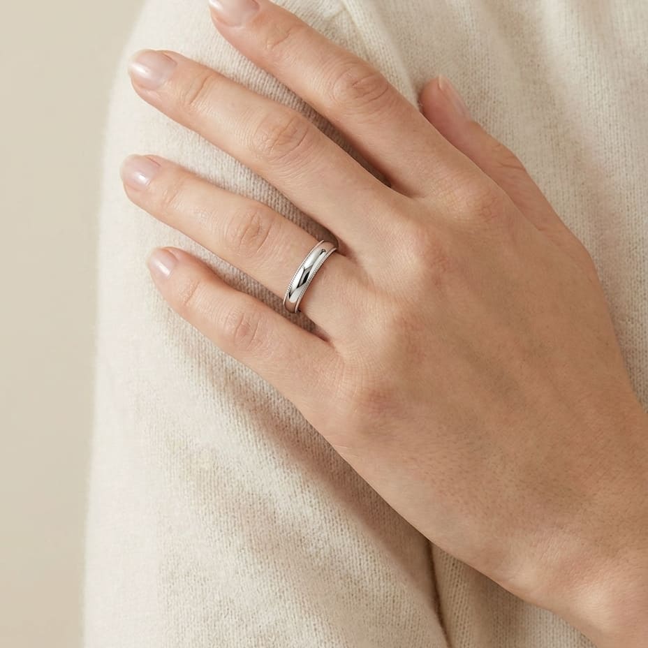 4mm Slightly Domed Traditional Oval Milgrain Wedding Band in Platinum, worn on hand, full view