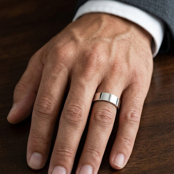 6mm Flat Comfort-Fit Wedding Band in Platinum, worn on hand, masculine close-up