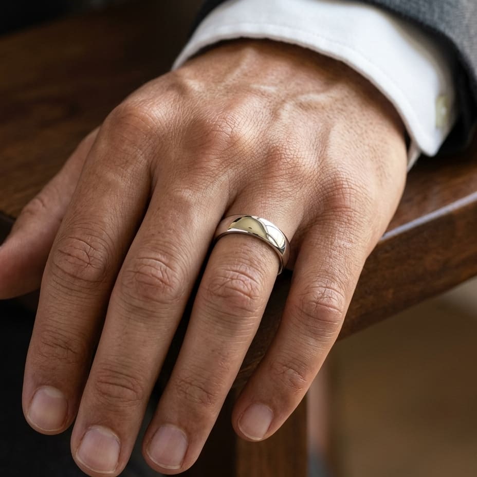6.5mm Deluxe Comfort-Fit Wedding Band in Platinum, worn on hand, masculine close-up