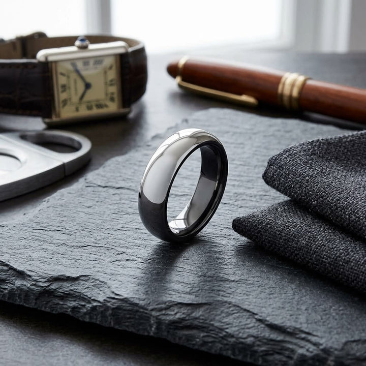 6mm High Dome Comfort-Fit Wedding Band in Platinum, on walnut surface with pocket square