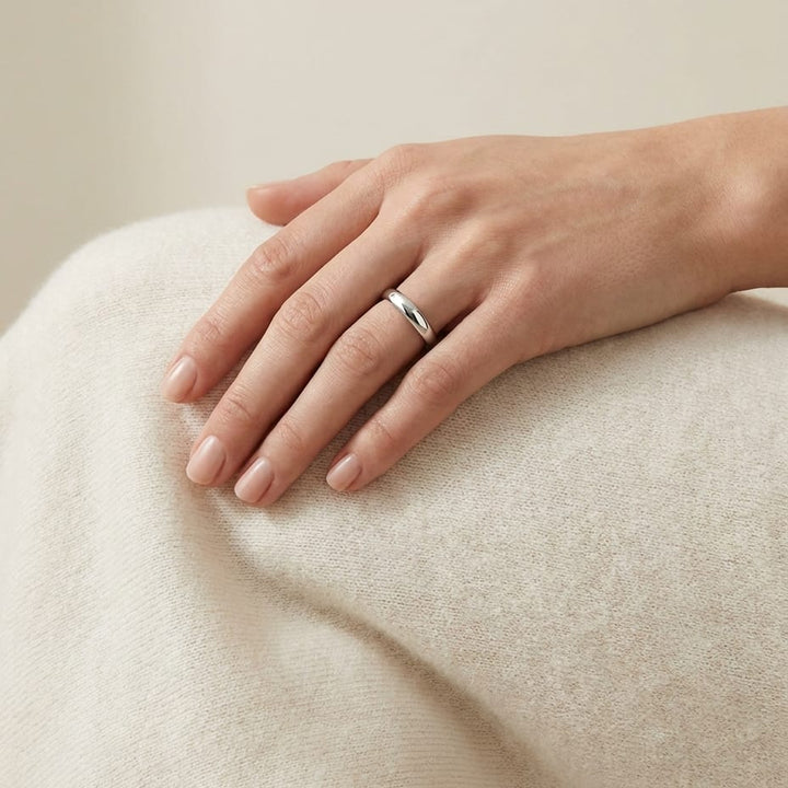 4mm Slightly Domed Comfort-Fit Wedding Band in Platinum, worn on hand, full view