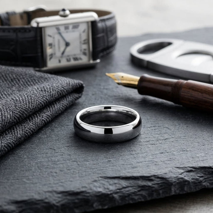 5mm Slightly Domed Comfort-Fit Wedding Band in Platinum, on walnut surface with pocket square